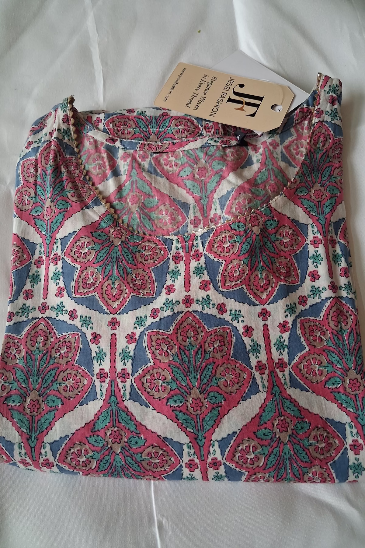 elegant off white floral printed kurti with pink & blue motifs