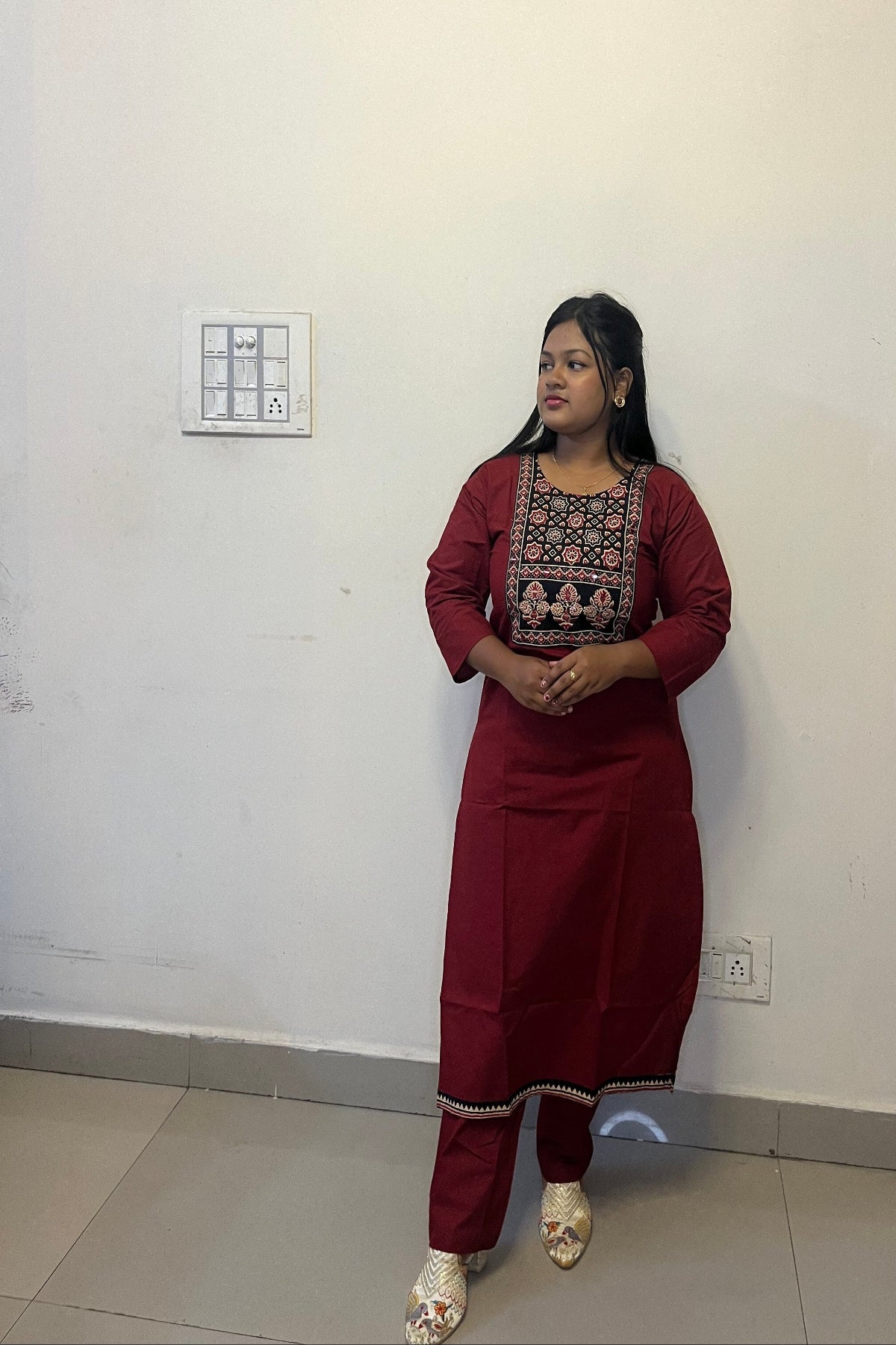 designer maroon kurti with floral motifs