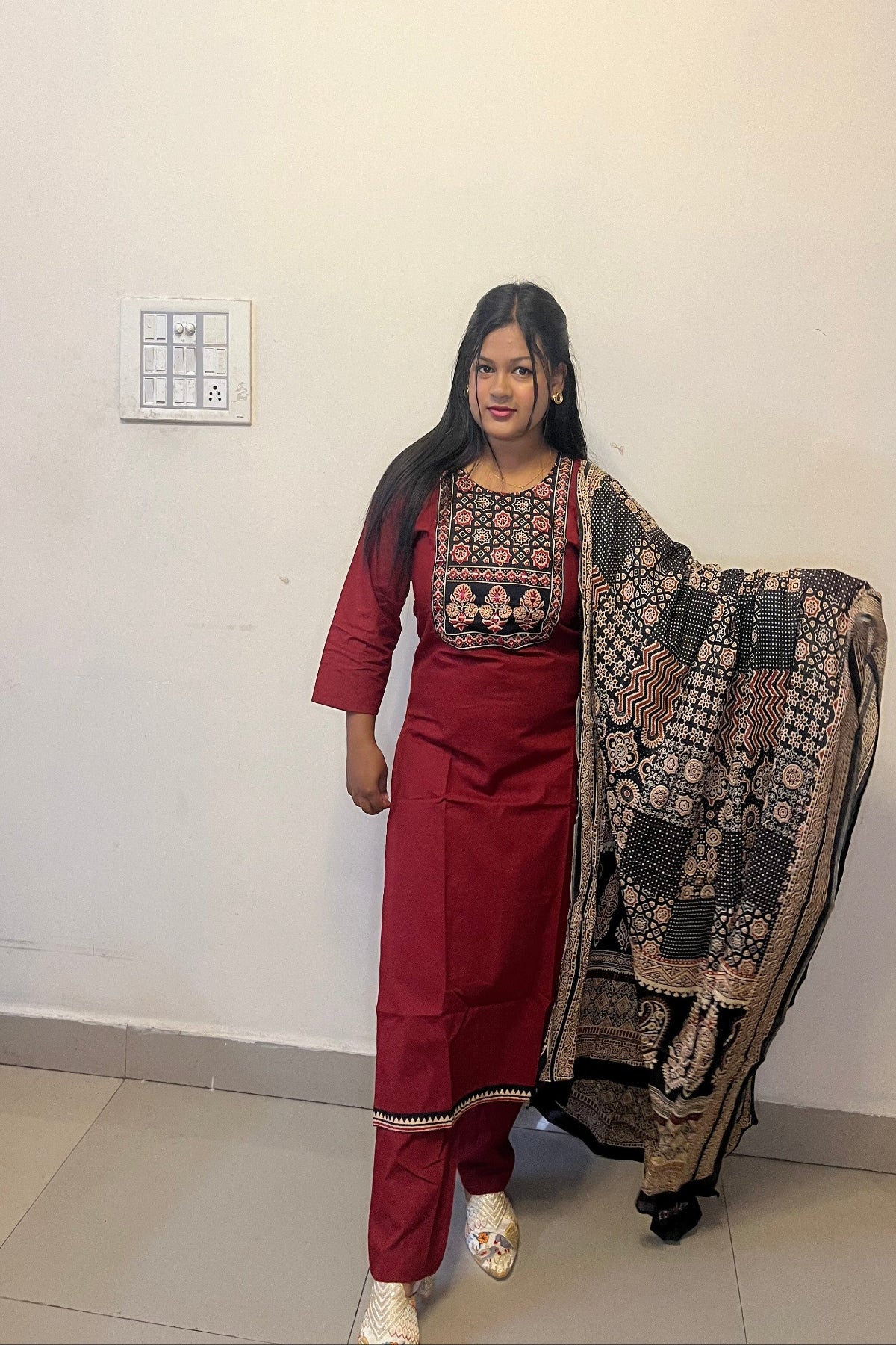 designer maroon kurti with floral motifs