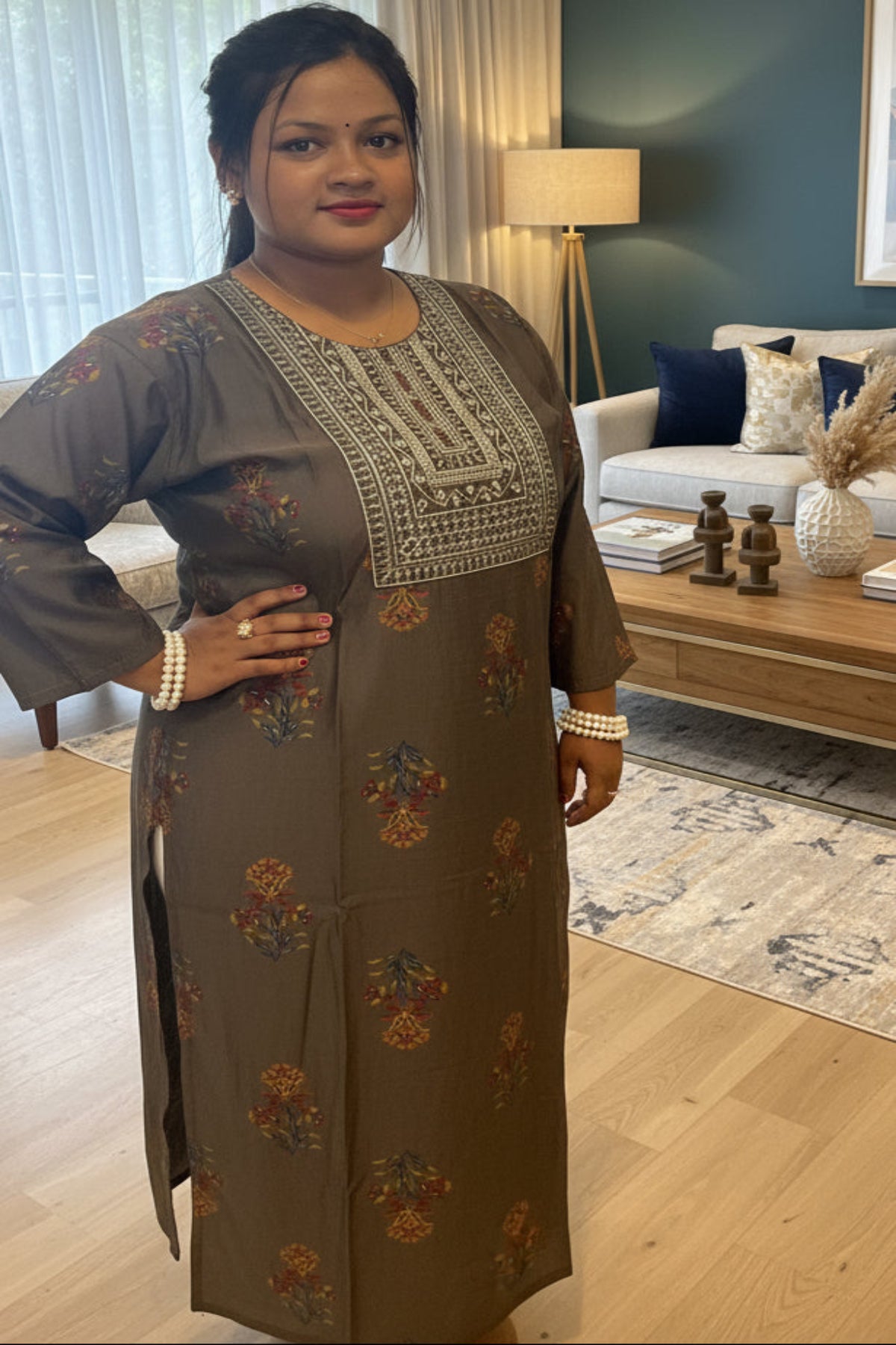 dark greenish-brown kurti with heavy golden sequin embroidery