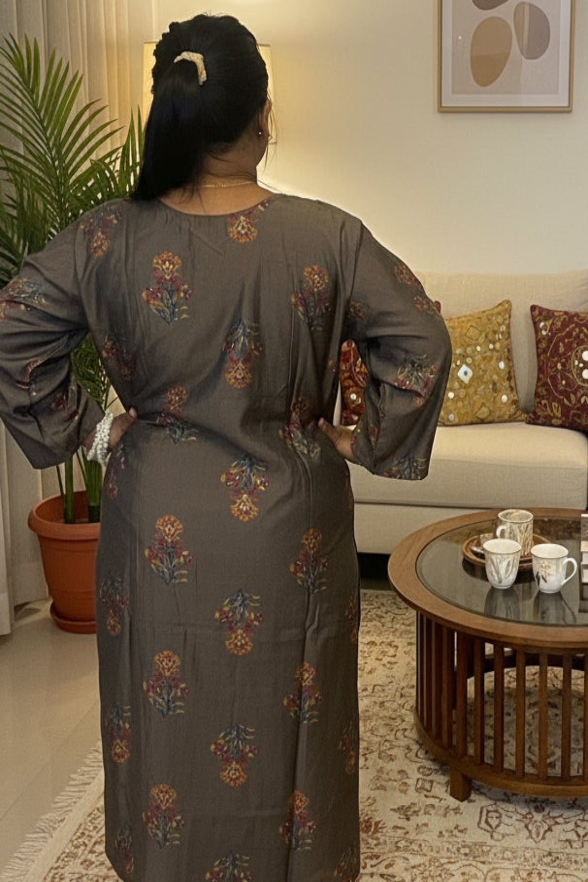 dark greenish-brown kurti with heavy golden sequin embroidery