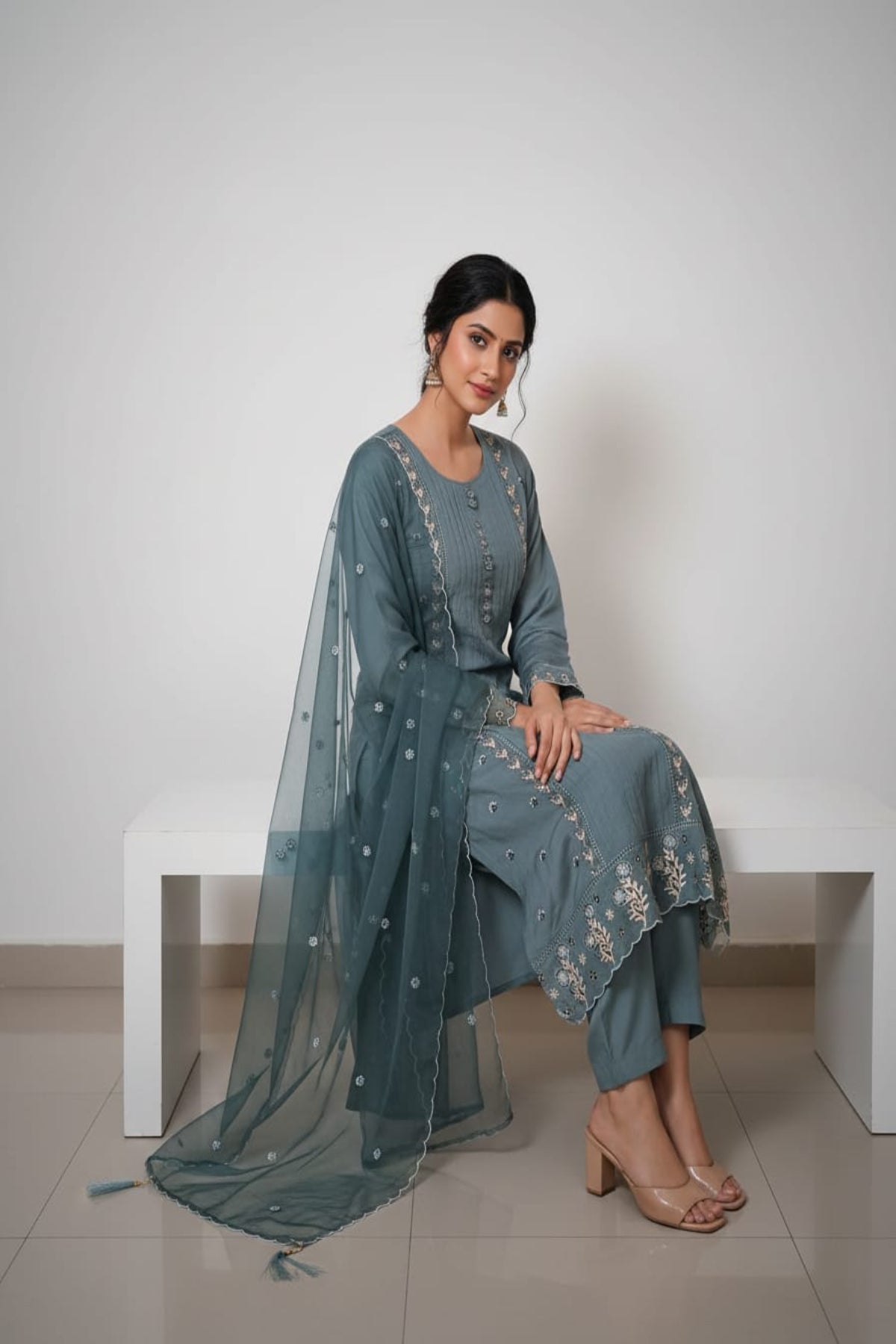 Teal green pintuck kurti with floral buttons & tread work